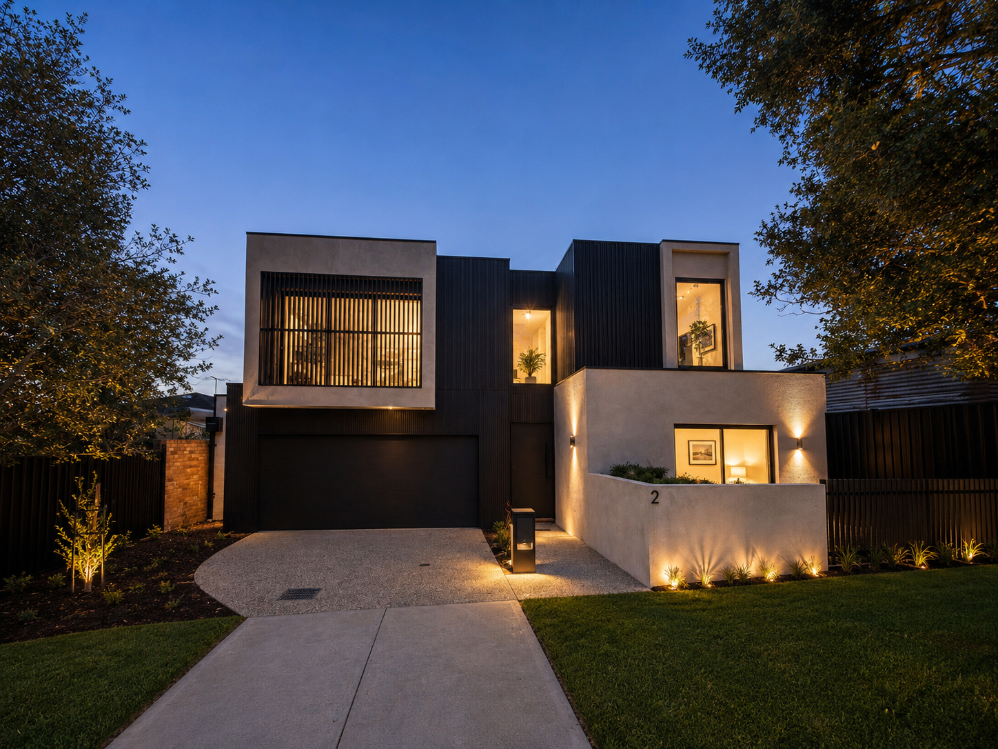 Modern new build, twilight exterior with feature lighting